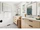 Bright bathroom featuring dual vanities, modern fixtures, and stylish terrazzo flooring at 939 Clarion Dr, Durham, NC 27705