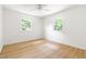 Bright, spacious bedroom featuring hardwood floors and two windows for ample natural light at 939 Clarion Dr, Durham, NC 27705