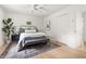 Bright bedroom featuring a ceiling fan, neutral colors, and hardwood flooring at 939 Clarion Dr, Durham, NC 27705