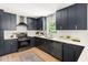 Well-lit kitchen featuring modern appliances, ample cabinet space, and a bright white backsplash at 939 Clarion Dr, Durham, NC 27705