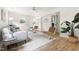 Cozy living room featuring modern furniture, hardwood flooring, and a ceiling fan at 939 Clarion Dr, Durham, NC 27705