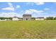 Expansive backyard with lush green grass and fence surrounding the property at 100 Arrowtown Way, Kenly, NC 27542
