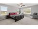 Bright bedroom with neutral walls, soft carpet, large windows, and comfortable seating area at 100 Arrowtown Way, Kenly, NC 27542