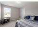Comfortable bedroom with large window, neutral walls, tv, and plush bedding at 100 Arrowtown Way, Kenly, NC 27542