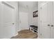 Inviting entryway with hardwood floors, a bench, and ample storage space at 100 Arrowtown Way, Kenly, NC 27542