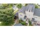 An aerial perspective showcases the home's desirable location, outdoor space, and architectural features at 100 Tobacco Leaf Ln, Apex, NC 27502