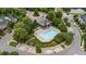 Community swimming pool with ample seating, surrounded by lush landscaping and well-maintained grounds at 100 Tobacco Leaf Ln, Apex, NC 27502