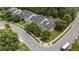 Overhead view of the residential area featuring townhouses with well-kept lawns and mature trees at 100 Tobacco Leaf Ln, Apex, NC 27502