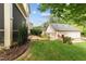 Beautiful backyard featuring lush green grass, tasteful landscaping, and well-maintained property exteriors at 100 Tobacco Leaf Ln, Apex, NC 27502