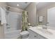 Bathroom with a white vanity, shower-tub combo, and a patterned shower curtain at 100 Tobacco Leaf Ln, Apex, NC 27502