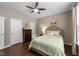 Comfortable bedroom with a ceiling fan, a dresser, and a well-coordinated decor that creates a relaxing ambiance at 100 Tobacco Leaf Ln, Apex, NC 27502