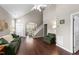 Spacious living room with vaulted ceilings, wood floors, fireplace, and open floor plan at 100 Tobacco Leaf Ln, Apex, NC 27502