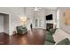 Inviting living room featuring vaulted ceilings, fireplace, and access to the patio at 100 Tobacco Leaf Ln, Apex, NC 27502