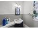Traditional bathroom with a dark vanity, patterned shower curtain, and neutral wall colors at 1022 Dorothea Dr, Raleigh, NC 27603