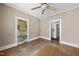 Bedroom featuring hardwood floors, ample natural light, and neutral colored walls at 1022 Dorothea Dr, Raleigh, NC 27603