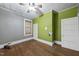 Bedroom featuring hardwood floors, ample natural light, and neutral colored walls at 1022 Dorothea Dr, Raleigh, NC 27603