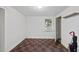 Bright bedroom with a checkered floor, window AC unit, and a closet, offering a comfortable living space at 1022 Dorothea Dr, Raleigh, NC 27603