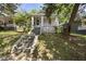 Charming home with a inviting front porch and mature trees surrounding the property at 1022 Dorothea Dr, Raleigh, NC 27603