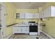 Traditional kitchen with classic fixtures, cabinetry, and ample countertop space at 1022 Dorothea Dr, Raleigh, NC 27603