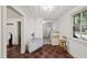 Living Room with a window, heater, kitchen, and an interesting tile floor at 1022 Dorothea Dr, Raleigh, NC 27603