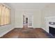 Spacious living room featuring hardwood floors, a fireplace, and natural light from windows at 1022 Dorothea Dr, Raleigh, NC 27603