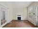 Living room with hardwood floors, fireplace, and natural light creating an inviting atmosphere at 1022 Dorothea Dr, Raleigh, NC 27603
