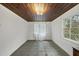 Bright living space with a wood ceiling, concrete floors, and natural light, perfect for relaxing or entertaining at 1022 Dorothea Dr, Raleigh, NC 27603