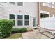 Cozy patio with a hammock surrounded by well-maintained shrubs and a private fence at 103 Ransomwood Dr, Apex, NC 27539
