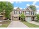 Charming townhome featuring a driveway and attached garage nestled in a well-maintained neighborhood at 103 Ransomwood Dr, Apex, NC 27539
