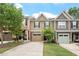 Charming townhome featuring a driveway and attached garage nestled in a well-maintained neighborhood at 103 Ransomwood Dr, Apex, NC 27539