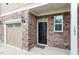Charming townhome featuring an attached garage with stylish brick and stone exterior at 103 Ransomwood Dr, Apex, NC 27539