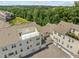 Aerial view of townhomes featuring rooftop decks and garages at 10310 Sablewood Dr # 211, Raleigh, NC 27617