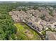 Aerial view of a townhome community with a pond at 10310 Sablewood Dr # 211, Raleigh, NC 27617