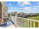 Balcony view overlooking lush green landscape and nearby residential buildings at 10310 Sablewood Dr # 211, Raleigh, NC 27617