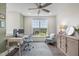 Bright office/bedroom featuring hardwood floors, large window, and comfortable seating at 10310 Sablewood Dr # 211, Raleigh, NC 27617
