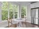 Bright breakfast nook with a table and chairs, next to a stainless steel refrigerator at 10310 Sablewood Dr # 211, Raleigh, NC 27617