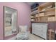 Organized closet space featuring shelves, a mirror, and a comfortable seating area at 10310 Sablewood Dr # 211, Raleigh, NC 27617
