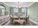 Stylish dining room with neutral decor, rustic table, and natural light creates a cozy space at 10310 Sablewood Dr # 211, Raleigh, NC 27617