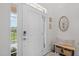 Inviting home entryway with bench seating, decor, and ample natural light at 10310 Sablewood Dr # 211, Raleigh, NC 27617