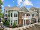 Exterior view of a multi-story apartment complex with brick accents and a private balcony at 10310 Sablewood Dr # 211, Raleigh, NC 27617