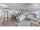 Bright open-concept living room and kitchen with lots of natural light and blue accents at 10310 Sablewood Dr # 211, Raleigh, NC 27617