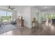 Cozy living room area featuring hardwood floors, an accent chair, and large windows at 10310 Sablewood Dr # 211, Raleigh, NC 27617