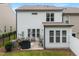 The backyard patio is great for entertaining with plenty of natural light shining through the windows at 1038 Felman Rd, Durham, NC 27703