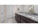 Bathroom featuring double sink vanity, framed mirror, and walk-in shower at 1038 Felman Rd, Durham, NC 27703
