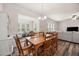 A dining room featuring a wood table and wood floors with white trim at 1038 Felman Rd, Durham, NC 27703