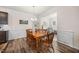 A dining room featuring a wood table and wood floors with white trim at 1038 Felman Rd, Durham, NC 27703