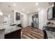 Modern kitchen featuring granite countertops, stainless steel appliances, and hardwood floors at 1038 Felman Rd, Durham, NC 27703