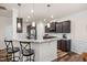 A kitchen featuring a breakfast bar with granite countertops and stainless steel appliances at 1038 Felman Rd, Durham, NC 27703