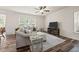 A living room featuring a comfortable sectional sofa and a media center at 1038 Felman Rd, Durham, NC 27703