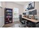 Comfortable home office featuring a bookshelf and multiple monitors for optimal productivity at 1038 Felman Rd, Durham, NC 27703